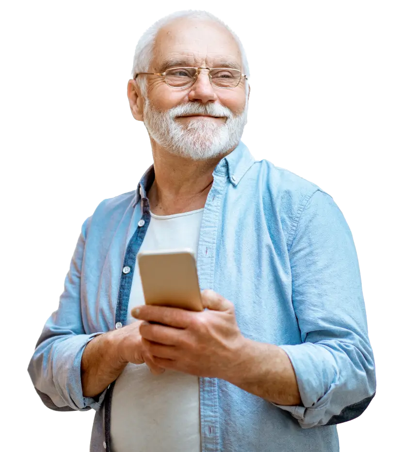 Confident senior man smiling thoughtfully while holding a smartphone, representing independent living and staying connected with family and caregivers.
